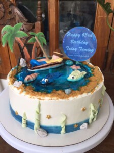 a man on a boat fishing cake design