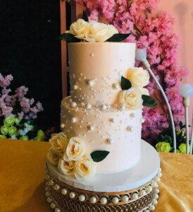 2 tier wedding cake - cream with white flowers